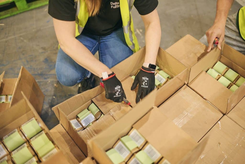 Staff at Delta Fulfilment preparing stock as part of our FBA Prep Services for a client. No matter if you’re considering FBA vs. FBM, Delta Fulfilment can support you to succeed as an Amazon seller.