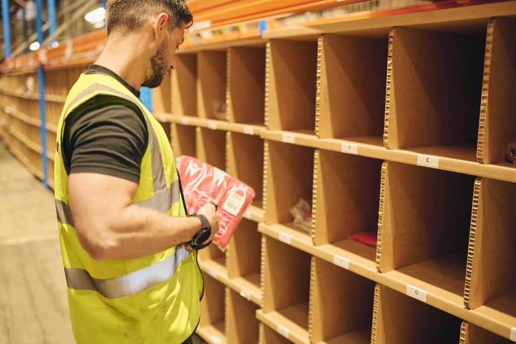 A Delta Fulfilment employee picking and packing products for a client that is using our Amazon Fulfilment Services. The client followed our best practices for selling with Amazon FBM.