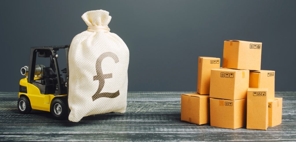 A model forklift lifting a bag of money by boxes to represent the fulfilment costs guide for 2025