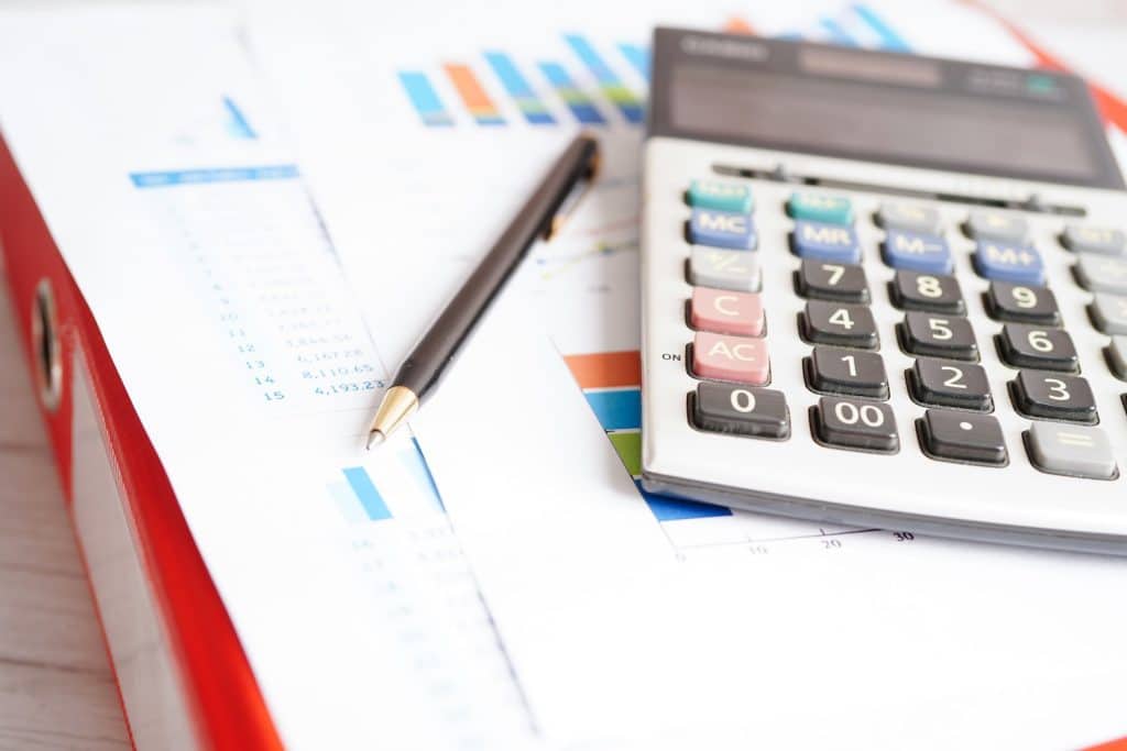 Sales data and a calculator to represent: ‘Forecasting Customer Demand: 7 Common Mistakes To Avoid’