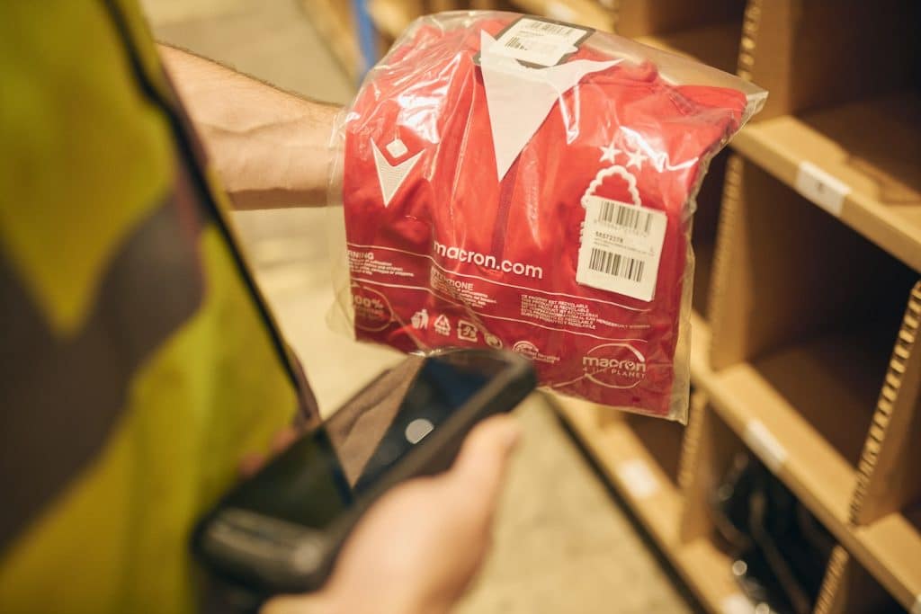 A member of staff from Delta Fulfilment is doing ecommerce returns after Black Friday.