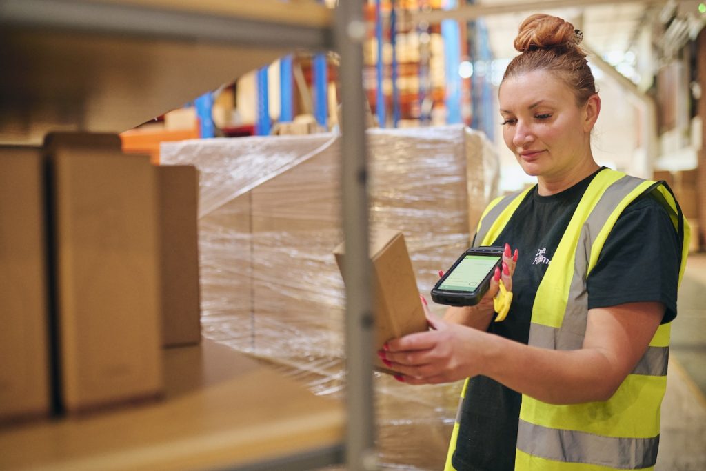 A member of Delta Fulfilment staff picking products to represent ‘how to streamline your picking and packing process’.