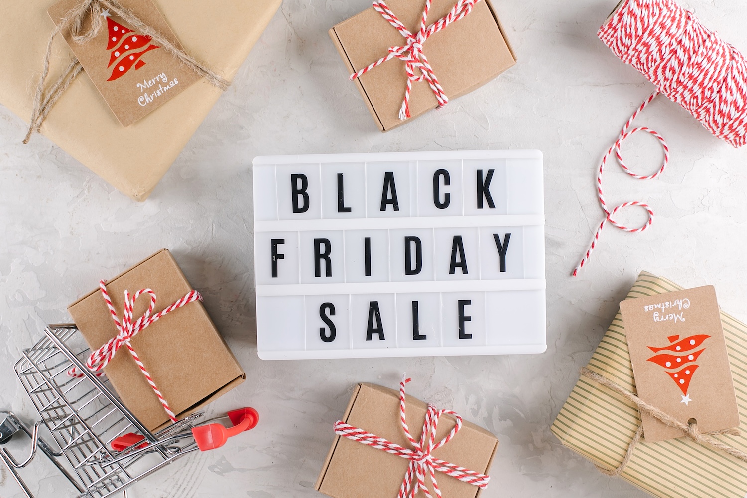 Lightbox text saying: Black Friday Sale, surrounded by boxes and shopping trolleys to represent Black Friday Demand Forecasting